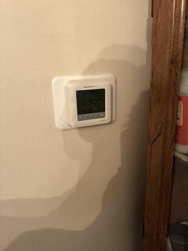 Completed installation of new air conditioning system. Verified electrical connections and system voltage readings at air handler unit, confirming proper power supply to equipment. Installed and programmed Honeywell Home digital thermostat, set to 75 degrees for customer comfort and system testing.