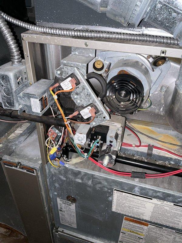 Conducted comprehensive assessment of existing HVAC system for full replacement estimate. Inspected furnace unit showing significant dust accumulation on internal components, blower motor assembly, and electrical connections. Evaluated ductwork configuration and existing PVC condensate drain system with shutoff valve. Documented current equipment condition and mechanical room layout to provide customer with complete system replacement options including appropriate sizing and configuration recommendations.