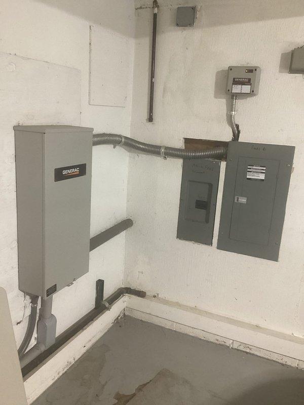 Responded to service call regarding generator system not providing power to kitchen circuits. Inspected Generac transfer switch installation, associated electrical panels, and exterior utility connections. Evaluated 200-amp transfer switch operation, verified proper conduit connections between generator cabinet and main distribution panels, and assessed overall system functionality to diagnose power distribution issue affecting kitchen branch circuits.