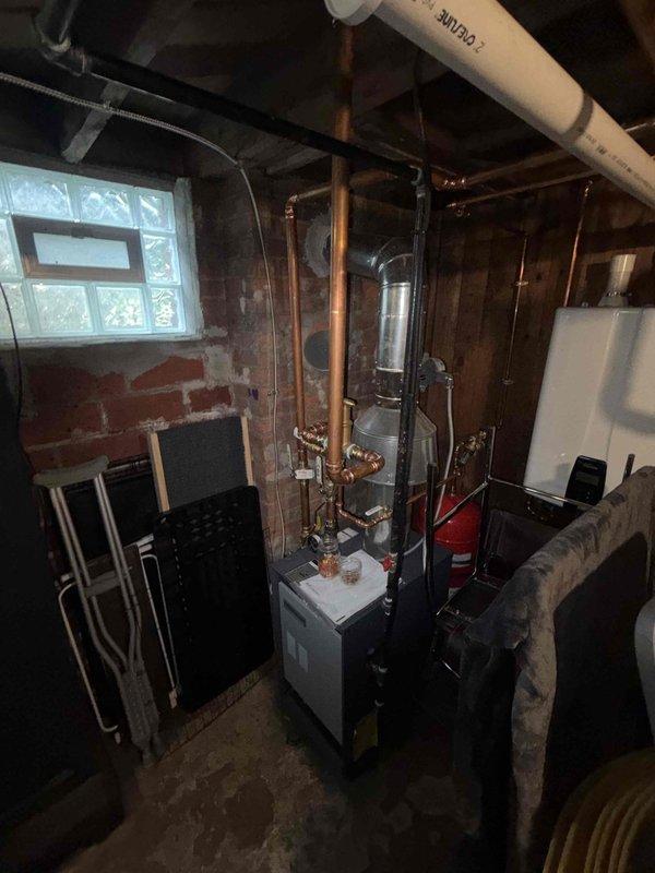 Completed warranty service on HVAC installation in mechanical room. Secured MC cable to copper piping per code requirements and relocated low voltage wiring away from gas line to ensure proper clearance and safety compliance. All electrical connections verified and system operational upon completion.
