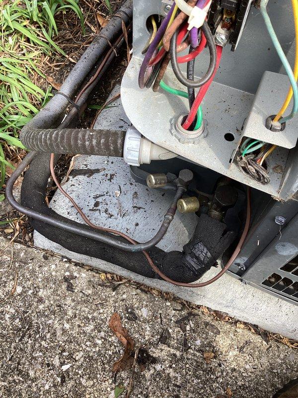 # HVAC Cooling Maintenance Service

Performed comprehensive preventive maintenance on outdoor air conditioning unit as part of recurring maintenance program. Conducted electrical diagnostics using megohmmeter to test compressor insulation resistance and motor windings, with readings indicating system components within acceptable parameters in the "Good" range. Accessed internal electrical components and refrigerant connections to perform thorough inspection and testing procedures. All electrical connections, refrigerant lines, and mechanical components found to be functioning properly with no immediate service needs identified. Unit left in operational condition.