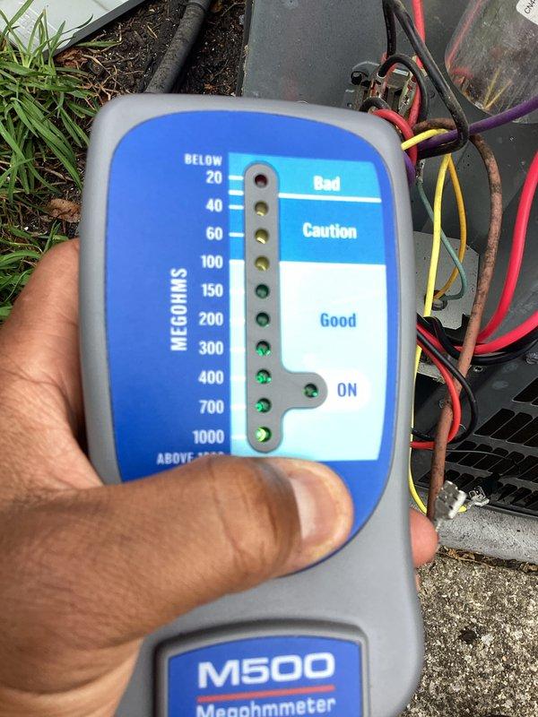 # HVAC Cooling Maintenance Service

Performed comprehensive preventive maintenance on outdoor air conditioning unit as part of recurring maintenance program. Conducted electrical diagnostics using megohmmeter to test compressor insulation resistance and motor windings, with readings indicating system components within acceptable parameters in the "Good" range. Accessed internal electrical components and refrigerant connections to perform thorough inspection and testing procedures. All electrical connections, refrigerant lines, and mechanical components found to be functioning properly with no immediate service needs identified. Unit left in operational condition.