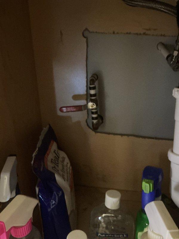 Responded to plumbing service call for outdoor faucet and bathtub leak. Upon inspection, accessed plumbing connections in interior cabinet space beneath fixture to assess leak source and verify proper operation of outdoor spigot system. Completed necessary repairs to resolve leaking condition and restore proper function to affected plumbing fixtures.
