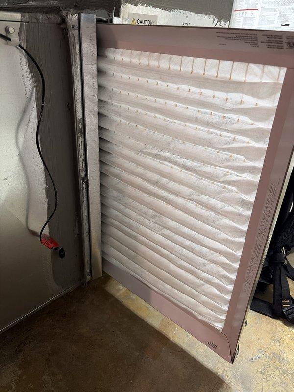 Completed comprehensive tune-up on 4-year-old air conditioning system. Performed standard maintenance protocol including inspection of all major components, cleaned condenser coils, checked refrigerant levels and pressures, verified electrical connections, tested capacitors, and confirmed proper system operation. Inspected air filter which showed clean condition with proper airflow. During electrical inspection, identified terminal block with significant corrosion and oxidation on connection points requiring monitoring or future replacement to prevent potential system failure. All other components operating within normal parameters. System cooling effectively with no immediate concerns noted beyond the corroded terminal connections.