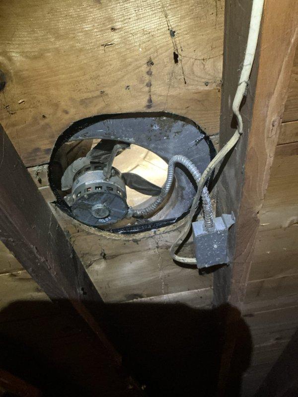 Conducted electrical site assessment in attic space for customer interested in electrical work. Inspected existing ventilation system components including blower motor assembly with flexible metallic ducting and associated wiring, as well as attic-mounted thermostat control unit with connected tubing. Documented current conditions via photos to provide accurate estimate for requested electrical modifications.