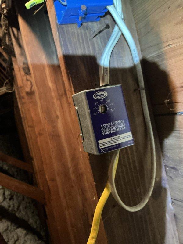 Conducted electrical site assessment in attic space for customer interested in electrical work. Inspected existing ventilation system components including blower motor assembly with flexible metallic ducting and associated wiring, as well as attic-mounted thermostat control unit with connected tubing. Documented current conditions via photos to provide accurate estimate for requested electrical modifications.