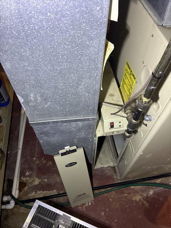 Conducted comprehensive site assessment for complete HVAC system replacement at residential property. Documented existing Carrier air handler unit and associated electrical infrastructure, including main panel circuit configuration and mechanical room conditions. Photographed current equipment placement, electrical connections, and utility space layout to develop accurate replacement specifications and ensure proper sizing for new system installation.