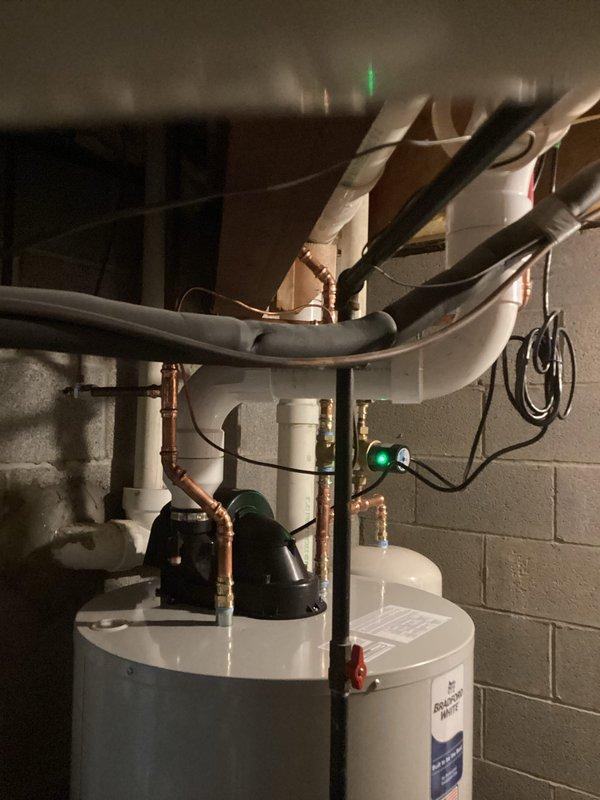 Installed a 75-gallon power vent water heater with iCON System control unit, including all necessary plumbing connections with copper piping, PVC venting, circulation pump integration, and code-compliant upgrades. The installation features proper pipe insulation, electrical wiring, and the advanced control system with digital temperature regulation and status monitoring capabilities.