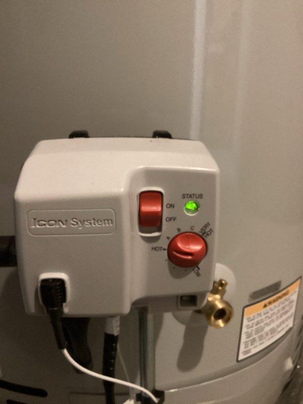 Installed a 75-gallon power vent water heater with iCON System control unit, including all necessary plumbing connections with copper piping, PVC venting, circulation pump integration, and code-compliant upgrades. The installation features proper pipe insulation, electrical wiring, and the advanced control system with digital temperature regulation and status monitoring capabilities.