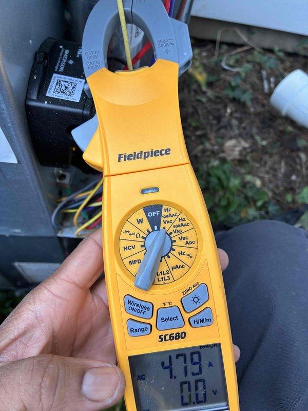 # HVAC Cooling Maintenance Completed

Performed comprehensive cooling system maintenance on residential air conditioning unit. Conducted electrical diagnostics using clamp meter to verify proper amperage draw and voltage levels at compressor terminals. Inspected and tested all electrical connections at terminal block, confirming secure wire terminations and proper contact integrity across all color-coded conductors. All system parameters measured within manufacturer specifications, with unit operating efficiently and safely.