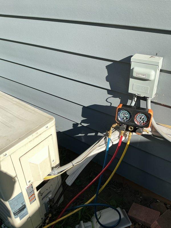 Responded to callback for ductless mini-split system displaying blue indicator light after being powered off during cooler weather. Connected manifold gauges to outdoor condensing unit and performed system diagnostics. Verified refrigerant pressures, checked electrical connections at disconnect box, and inspected indoor wall-mounted air handler. System operating normally with no refrigerant loss or mechanical issues detected; blue light was part of normal startup sequence and cleared after system stabilization. Responded to callback for ductless mini-split system displaying blue indicator light after being powered off during cooler weather. Connected manifold gauges to outdoor condensing unit and performed system diagnostics. Verified refrigerant pressures, checked electrical connections at disconnect box, and inspected indoor wall-mounted air handler. System operating normally with no refrigerant loss or mechanical issues detected; blue light was part of normal startup sequence and cleared after system stabilization.