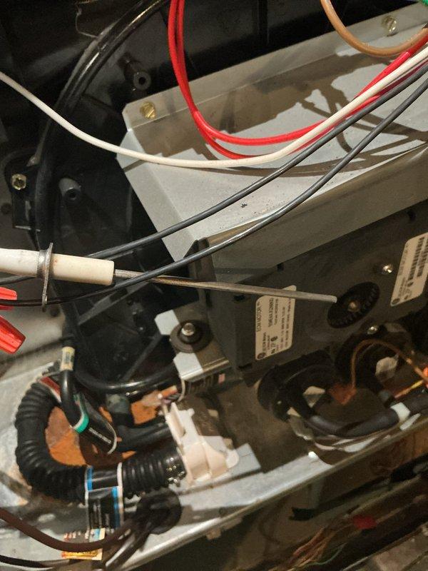 Completed heating maintenance on two HVAC systems, performing comprehensive inspections and testing of all components. Verified electrical connections, measured system voltages reading 12.50V on diagnostic equipment, inspected flexible metal conduit connections, and confirmed proper wire routing including power and control wiring throughout both units.