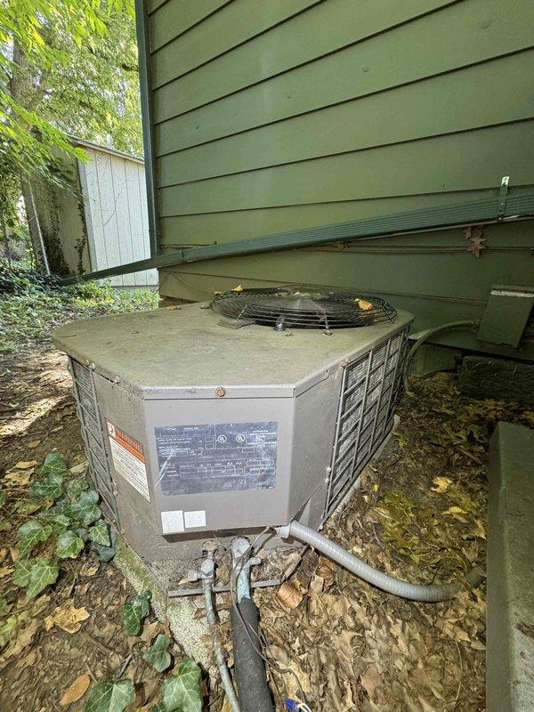 Responded to service call for two non-operational AC units at duplex property. First unit presented with humming noise but no cooling operation; diagnosed failed compressor capacitor and replaced with appropriate rated component, restoring normal function. Second unit at adjacent duplex showed no power; identified tripped breaker at electrical panel, reset breaker, and verified proper startup sequence and cooling operation. Cleared debris from both condenser units and confirmed adequate airflow through coils.