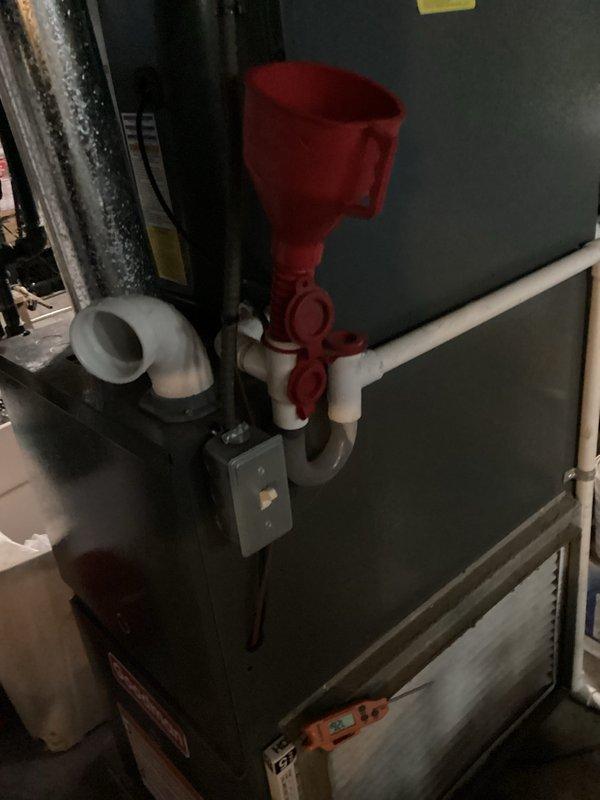 Completed routine cooling maintenance visit on residential HVAC system. Inspected furnace unit and air handler assembly, verified proper operation of condensate drain system with collection funnel and PVC piping configuration, and replaced air filter with new pleated unit. All components operating within normal parameters with no deficiencies noted.