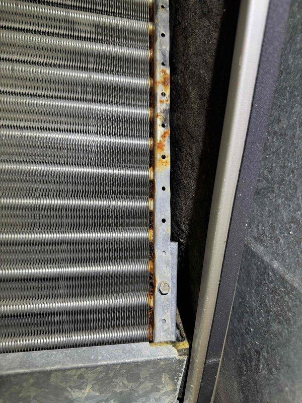 Completed comprehensive seasonal tune-up on both heating and cooling systems. Performed standard maintenance procedures including inspection of outdoor condenser unit, which showed normal operation with minor rust formation noted on heat exchanger coil frame and mounting edges. Assessed air duct system for reported damage; all ductwork found intact with no repairs required.