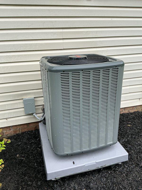 Completed scheduled maintenance visit on residential HVAC system including both outdoor condensing unit and indoor air handler components. Performed comprehensive inspection of exterior condenser unit, verified proper operation of compressor and condenser fan motor, checked electrical connections at disconnect box, and confirmed adequate airflow through coil louvers. Inspected indoor furnace assembly including blower motor operation, control board functionality, electrical connections, and air filter condition, documenting system status with photographs for service records.