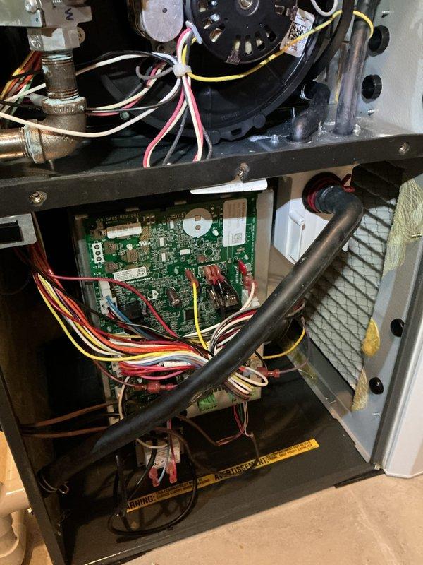 Completed scheduled maintenance visit on residential HVAC system including both outdoor condensing unit and indoor air handler components. Performed comprehensive inspection of exterior condenser unit, verified proper operation of compressor and condenser fan motor, checked electrical connections at disconnect box, and confirmed adequate airflow through coil louvers. Inspected indoor furnace assembly including blower motor operation, control board functionality, electrical connections, and air filter condition, documenting system status with photographs for service records.