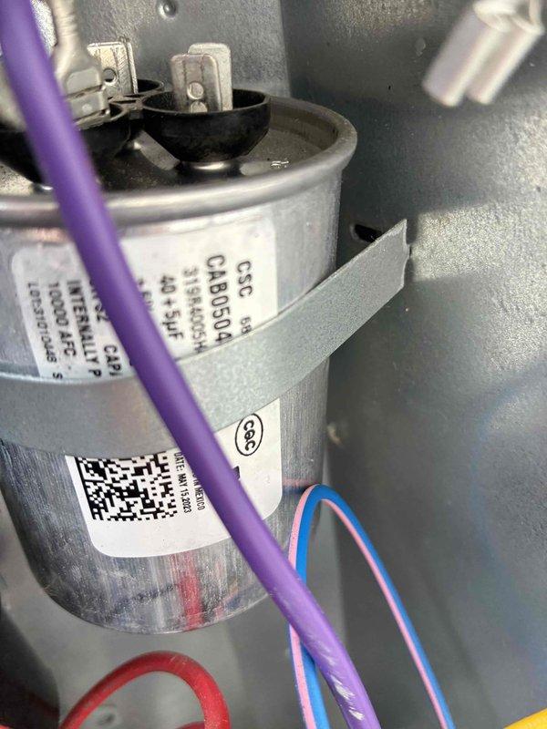 # HVAC Cooling Maintenance Service

Performed routine preventive maintenance on residential cooling system. Inspected and tested dual-run capacitor (40+5 µF, 450VAC, model CBB65A) using digital multimeter to verify proper capacitance values and electrical performance. All electrical connections were secure, and capacitor readings were within manufacturer specifications. System operational and functioning properly upon completion of maintenance inspection.