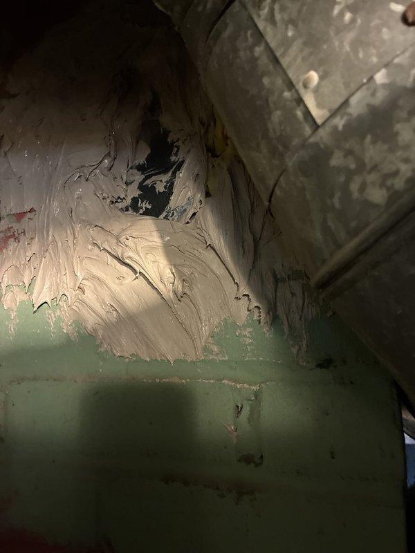 Responded to failed inspection for HVAC installation. Documented abandoned inlet openings and PVC vent pipe terminations extending through exterior siding that require correction to meet code requirements. Photographed exterior vent configuration and interior attic space showing connector and insulation conditions for compliance verification and correction planning.