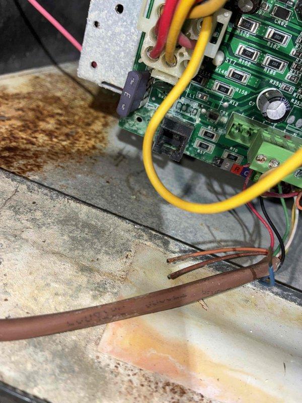 Responded to no-heat call for furnace diagnostic. Upon inspection, found control board showing signs of moisture damage and corrosion on circuit board surface and surrounding cabinet area. Evaluated electrical connections, wiring harness, and blower assembly. Documented existing conditions with photos showing compromised control board and interior components requiring attention.