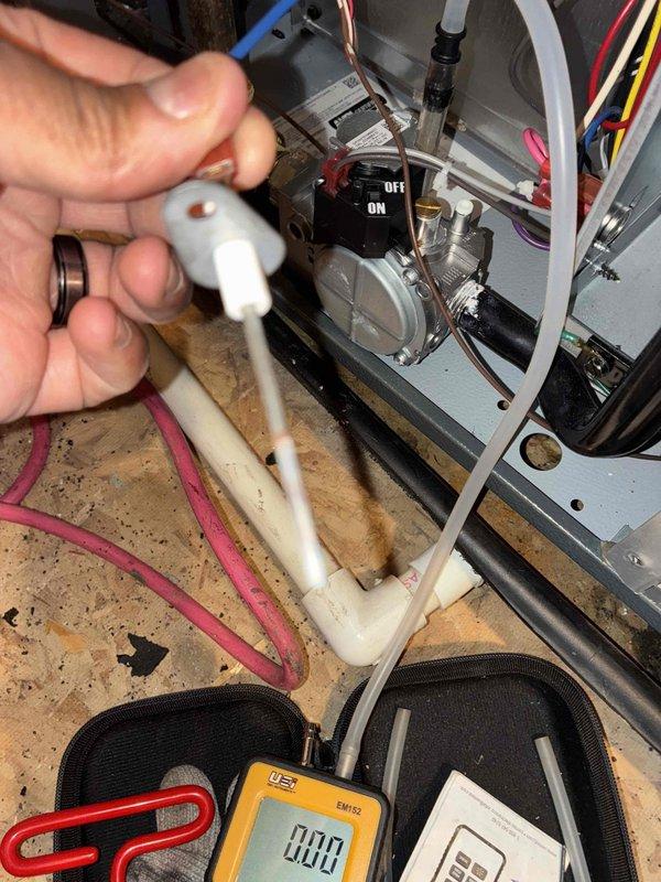 Completed scheduled heating maintenance on residential furnace system. Performed comprehensive inspection of all major components including heat exchanger, blower assembly, and condensate drainage system. Inspected and tested furnace condensate trap and drain line assembly, verifying proper drainage and trap seal integrity. Examined all electrical connections, control wiring, and safety switches for secure mounting and proper operation. Utilized digital multimeter to verify electrical readings and system performance parameters. Checked gas supply piping, connections, and shut-off valve for leaks and proper installation. All components found to be operating within normal specifications with no immediate concerns identified. System ready for heating season operation.