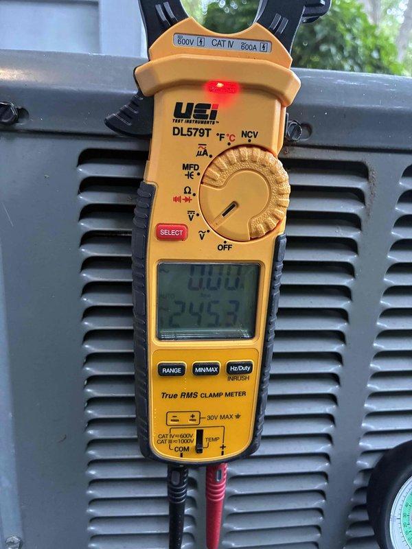 # HVAC Cooling Maintenance Service

Completed comprehensive preventive maintenance inspection on residential air conditioning system. Performed electrical diagnostics using True RMS clamp meter, verifying proper amperage draw and voltage levels at the condensing unit, with readings indicating normal operation at 24.53V and 0.00A at time of measurement. Measured supply air temperature at 68.5°F using calibrated digital thermometer at the air handler, confirming system performance within acceptable parameters for cooling mode operation.