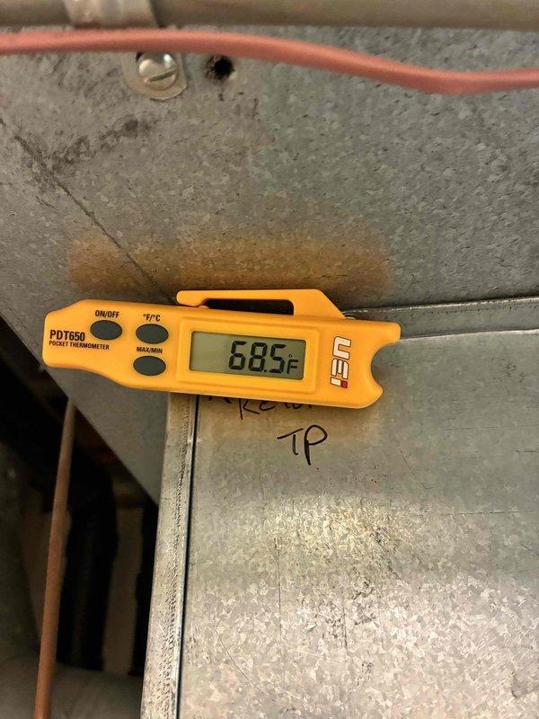 # HVAC Cooling Maintenance Service

Completed comprehensive preventive maintenance inspection on residential air conditioning system. Performed electrical diagnostics using True RMS clamp meter, verifying proper amperage draw and voltage levels at the condensing unit, with readings indicating normal operation at 24.53V and 0.00A at time of measurement. Measured supply air temperature at 68.5°F using calibrated digital thermometer at the air handler, confirming system performance within acceptable parameters for cooling mode operation.