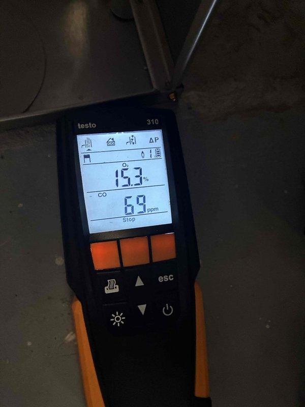 Completed comprehensive heating tune-up on 8-ton HVAC system for non-member customer. Performed combustion analysis using Testo 310 analyzer, recording oxygen levels at 15.3% and carbon monoxide at 69 ppm, and conducted temperature measurements across ductwork using digital thermometer to verify proper system operation and airflow distribution.
