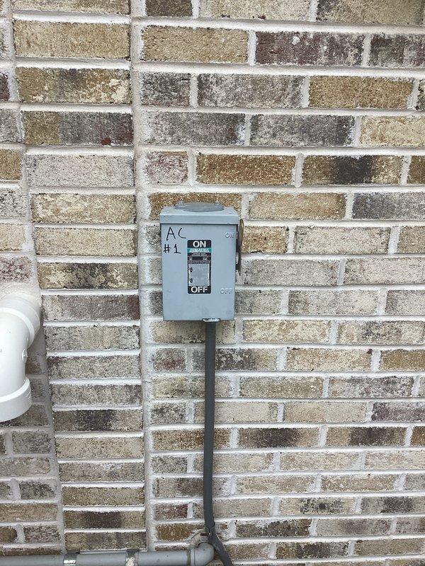 Responded to service call for air conditioning system not operating. Upon arrival, inspected exterior AC disconnect box mounted on building exterior and verified proper labeling and conduit connections. Investigated reported short circuit condition in electrical panel affecting AC operation. Performed diagnostic testing and visual inspection of electrical components. Verified Carrier Infinity System thermostat displaying proper temperature readings and communication with HVAC system. Restored power to AC unit through disconnect switch, confirming system returned to normal operation with thermostat registering 75° indoor temperature.