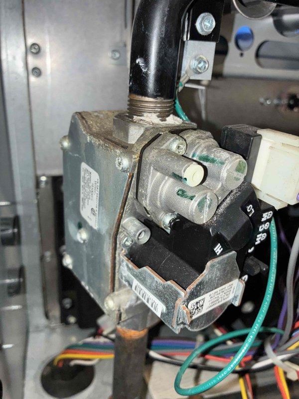 Completed scheduled heating maintenance on residential gas furnace system as part of ongoing preventative maintenance program. Performed comprehensive inspection of furnace cabinet, gas valve assembly, heat exchanger, and all associated mechanical components. Verified proper operation of gas valve connections, control wiring, and safety mechanisms. Inspected burner assembly, flame sensor, and ignition system for proper function. Checked all electrical connections including ground wires and control board wiring harness. Examined PVC venting system and condensate drainage lines for proper installation and flow. Verified evaporator coil condition and refrigerant line connections. System tested and operating within manufacturer specifications with all safety controls functioning properly.