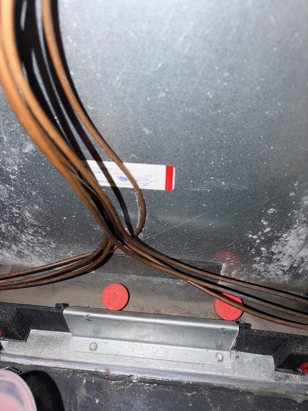 Completed HVAC system maintenance and repairs including installation of replacement UV bulb, placement of drain tablets for condensate line treatment, and repair of damaged electrical wiring that had been compromised by rodent activity. All electrical connections were restored to proper working condition and system was tested for safe operation.