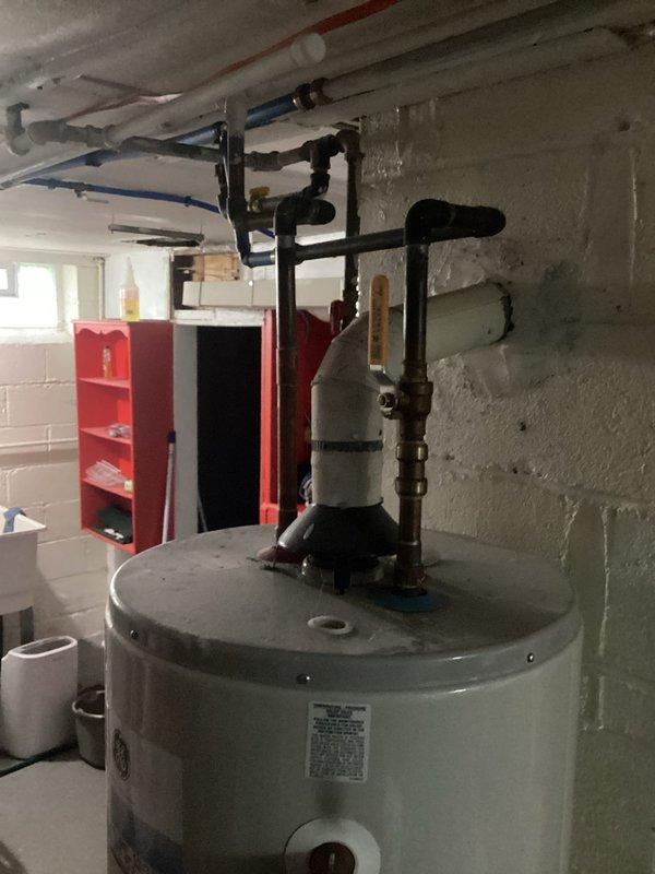 Responded to service call for tanked water heater with pilot light that would not remain lit. Upon inspection of the residential gas water heater unit, diagnosed thermocouple failure preventing proper flame detection and causing pilot light to extinguish. Collected standard service call fee for diagnostic visit and provided customer with repair options to restore hot water functionality.