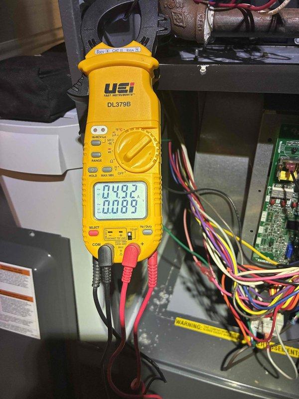 # HVAC Heating Maintenance Completed

Performed comprehensive heating system maintenance as part of ongoing preventive maintenance program. Conducted thorough electrical diagnostics using digital clamp meter to measure voltage and amperage readings across furnace components, verifying proper electrical performance and system operation. All measurements fell within manufacturer specifications, indicating healthy system function. Inspected internal mechanical components, wiring connections, and control board. System tested and confirmed operational for heating season.