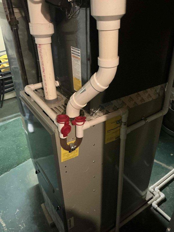 Conducted on-site assessment of existing residential furnace system to provide replacement options. Documented current HVAC equipment including furnace cabinet, PVC venting configuration, gas line connections with shut-off valves, and condensate drainage system to determine specifications for replacement unit recommendations.