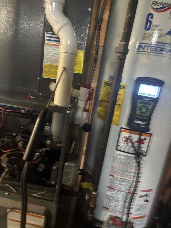 Performed comprehensive heating system tune-up on residential furnace and inspected associated HVAC components. Conducted visual inspection of ductwork interior, noting dust accumulation and minor surface corrosion typical of normal system operation. Completed standard maintenance procedures on gas furnace unit, verified proper operation of water heater with diagnostic testing equipment, and confirmed all mechanical connections and piping systems were secure and functioning correctly.