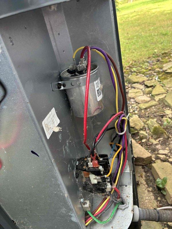 Responded to no cooling call where outdoor condenser unit was not operating. Upon inspection, found blown fuses in the outdoor unit's electrical panel. Replaced defective fuses and verified proper capacitor operation and all electrical connections. System tested successfully with condenser fan motor and compressor operating normally, restoring full cooling function to the unit.