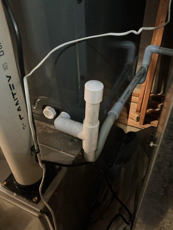 Responded to service call for reported furnace leak. Upon inspection, identified condensate drainage issue affecting the heating system. Installed new condensate drain assembly with PVC piping configuration and proper trap to prevent future water accumulation. System tested and verified operational with no active leaks present at time of departure.