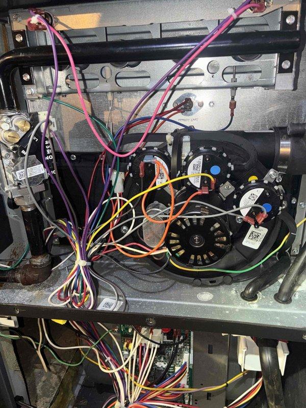 Completed annual preventative maintenance on a 2-year-old Goodman furnace system. Performed comprehensive tune-up including inspection of blower motor assembly, dual run capacitors, gas valve, and all electrical connections. Verified all wiring harnesses are properly secured and organized, tested system amperage draw at 8.1 amps indicating normal operation, and confirmed all mechanical components are functioning within manufacturer specifications. System is operating efficiently with no deficiencies noted.