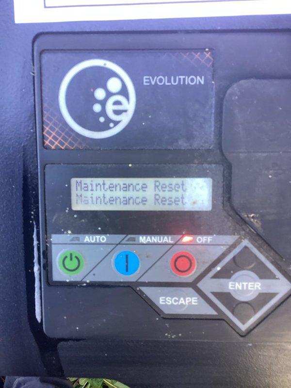 Performed scheduled maintenance on a Generac Guardian Series 22kW residential backup generator. Completed maintenance reset procedure through the Evolution controller interface, verified all system indicators functioning properly with AUTO/MANUAL/OFF controls operational and display responding correctly. Unit confirmed in good working condition with all safety systems tested and operational.