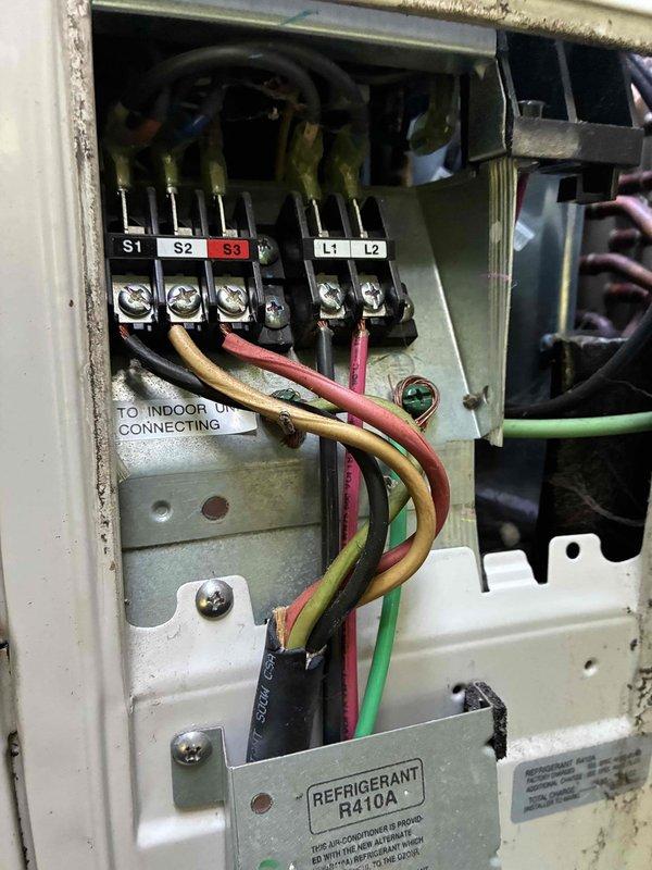 # HVAC Heating Maintenance Summary

Completed scheduled preventive maintenance on mini-split heating system utilizing R410A refrigerant. Inspected and verified proper electrical connections at outdoor unit terminal block, confirming secure wiring at S1, S2, S3, L1, and L2 terminals with proper conductor routing to indoor unit. Examined and tested fuse assembly, ensuring electrical protection components were functioning within specifications and properly seated in housing.

---

# Detailed Work Performed

Performed comprehensive heating season maintenance on mini-split heat pump system as part of ongoing service plan. Conducted thorough inspection of outdoor unit electrical control panel, verifying integrity of all wire connections at main terminal block. Confirmed proper termination of line voltage and control wiring at designated terminals S1, S2, S3, L1, and L2. Inspected communication and power supply wiring between outdoor condensing unit and indoor air handling unit for signs of w