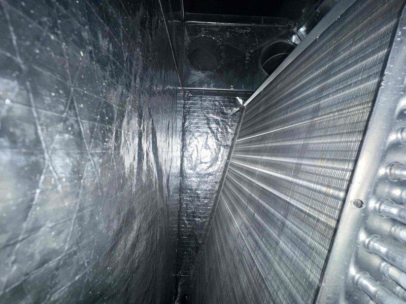 Completed routine cooling system maintenance on HVAC air handler unit. Accessed evaporator coil compartment and inspected finned heat exchanger for cleanliness and proper condition. Verified foil-faced insulation integrity within unit housing. Replaced air filter with new pleated filter and confirmed proper fitment in return air assembly. Inspected ductwork connections and internal components for normal operation. All system components found in satisfactory working condition with no issues identified.