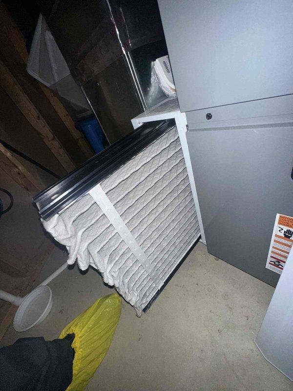 Completed routine cooling system maintenance on HVAC air handler unit. Accessed evaporator coil compartment and inspected finned heat exchanger for cleanliness and proper condition. Verified foil-faced insulation integrity within unit housing. Replaced air filter with new pleated filter and confirmed proper fitment in return air assembly. Inspected ductwork connections and internal components for normal operation. All system components found in satisfactory working condition with no issues identified.