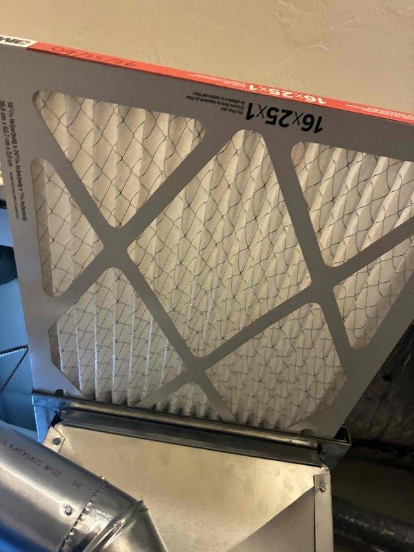 Completed scheduled heating maintenance on residential furnace system. Performed electrical diagnostics using clamp meter to verify proper amperage draw and system performance, with readings indicating normal operation at 0.004 amps and 42-degree temperature differential. Replaced 16x25x1 pleated air filter to ensure optimal airflow and system efficiency for the heating season.