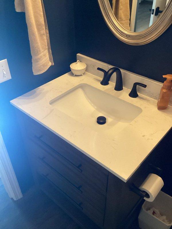 Responded to complaint of sewer odor in first-floor half bathroom following recent renovation. Inspected toilet installation and confirmed improper wax ring seal was causing odor infiltration. Removed toilet, replaced faulty wax ring with proper-sized wax seal, reset toilet to flange, and verified proper seal with leak test. Sewer odor issue resolved.