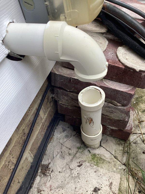 Responded to plumbing service call at vacant residential property for multiple leak issues in basement. Assessed and addressed water pressure reducing valve (PRV) leak showing significant corrosion and deterioration on curved pipe section. Inspected drain pipe leak in basement area with bucket positioned to catch water. Evaluated sump pump discharge system on exterior back left side of building, identifying cracked PVC pipe requiring repair at 90-degree elbow joint connection. Documented all affected plumbing components with photographs showing extent of corrosion on metal piping and damage to exterior drainage system. Provided assessment and repair recommendations for corroded PRV assembly, basement drain leak, and compromised sump pump discharge line to prevent future water damage. Responded to plumbing service call at vacant residential property for multiple leak issues in basement. Assessed and addressed water pressure reducing valve (PRV) leak showing significant corrosion and deterioration on curved pipe section. Inspected drain pipe leak in basement area with bucket positioned to catch water. Evaluated sump pump discharge system on exterior back left side of building, identifying cracked PVC pipe requiring repair at 90-degree elbow joint connection. Documented all affected plumbing components with photographs showing extent of corrosion on metal piping and damage to exterior drainage system. Provided assessment and repair recommendations for corroded PRV assembly, basement drain leak, and compromised sump pump discharge line to prevent future water damage.