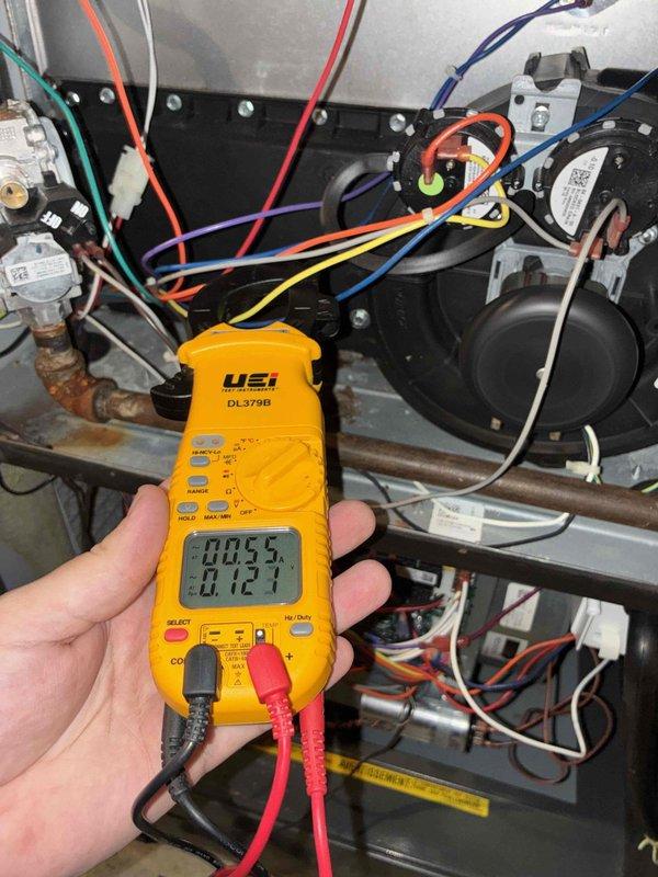 # HVAC Heating Maintenance Summary

Completed comprehensive heating maintenance service on residential furnace system as part of scheduled preventive maintenance program. Performed thorough inspection of all furnace components including heat exchanger, blower motor assembly, gas valve, and burner system.

# Detailed Work Performed

Conducted electrical diagnostics using digital multimeter to verify proper voltage and amperage readings across control circuits and safety devices. Measured microamp readings on flame sensor circuit, recording 0.053 and 0.121 values to confirm adequate flame rectification for safe ignition and operation. Verified all electrical connections were secure throughout the control board, transformer, and wiring harnesses.

Inspected blower motor assembly and confirmed proper operation. Checked all wire connections including thermostat wiring (R, C, W, G, Y terminals) and verified color-coded wiring was properly terminated at control board and components. Examined 
