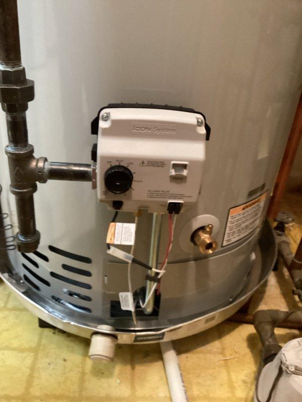 Replaced existing 40-gallon short water heater with new unit including all necessary code upgrades. Installation included mounting new water heater on wooden platform with proper clearances, installing icon System gas control valve with electronic ignition, connecting temperature and pressure relief valve with discharge piping, and configuring complete copper supply and distribution piping system with shutoff valves. Added expansion tank to plumbing system for thermal expansion management and pressure regulation. Completed all gas line connections, installed PVC condensate drainage system at base of unit, and ensured proper venting configuration. All work performed to current plumbing and building code standards with upgraded safety features and control systems.