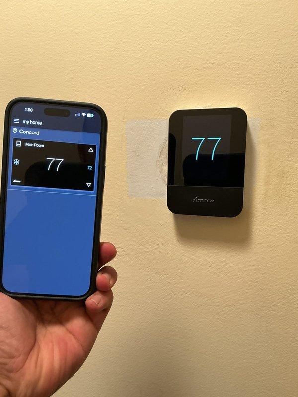 Responded to service call for thermostat communication failure with furnace system. Upon arrival, verified that the Amana wall-mounted digital thermostat was not establishing proper communication with the heating unit. Diagnosed the issue, restored connectivity between the thermostat and furnace control board, and confirmed proper system operation with temperature display functioning correctly at 77°F on both the physical thermostat and connected mobile application. Responded to service call for thermostat communication failure with furnace system. Upon arrival, verified that the Amana wall-mounted digital thermostat was not establishing proper communication with the heating unit. Diagnosed the issue, restored connectivity between the thermostat and furnace control board, and confirmed proper system operation with temperature display functioning correctly at 77°F on both the physical thermostat and connected mobile application.