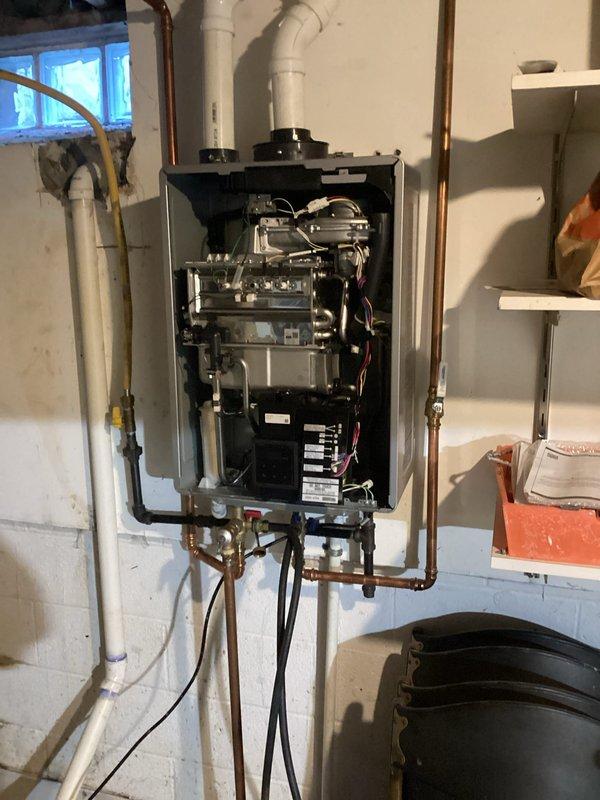 Gates Mills, OH - Performed comprehensive descaling and flush service on wall-mounted tankless water heater unit. Accessed internal components, circulated descaling solution through heat exchanger to remove mineral buildup, flushed system with clean water, and verified proper operation of all mechanical components and connections. Gates Mills, OH - Performed comprehensive descaling and flush service on wall-mounted tankless water heater unit. Accessed internal components, circulated descaling solution through heat exchanger to remove mineral buildup, flushed system with clean water, and verified proper operation of all mechanical components and connections.