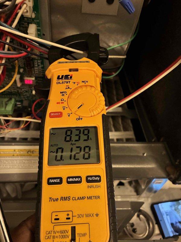 Completed comprehensive heating system maintenance on HVAC unit. Performed inspection of blower assembly, noting normal operational dust accumulation on squirrel cage fan blades. Verified electrical performance using clamp meter, measuring current draw at 0.39 amps, which falls within acceptable operating parameters for the system. All components inspected and found to be functioning properly with no immediate service needs identified. Completed comprehensive heating system maintenance on HVAC unit. Performed inspection of blower assembly, noting normal operational dust accumulation on squirrel cage fan blades. Verified electrical performance using clamp meter, measuring current draw at 0.39 amps, which falls within acceptable operating parameters for the system. All components inspected and found to be functioning properly with no immediate service needs identified.